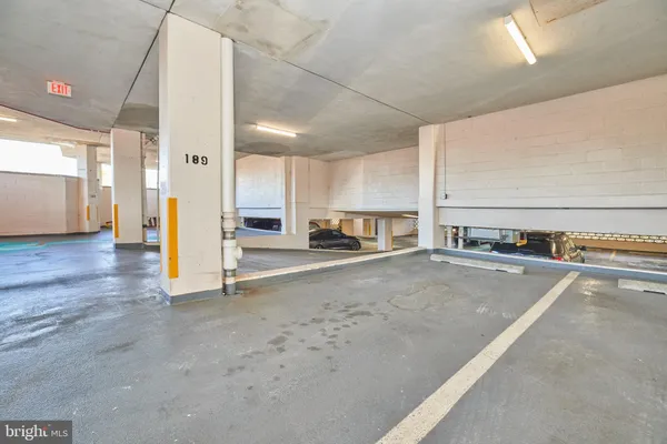 a view of a kitchen with a sink and cabinets
