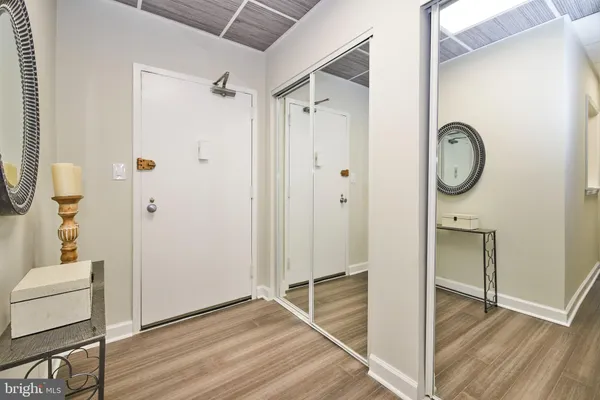 a view of room with wooden floor