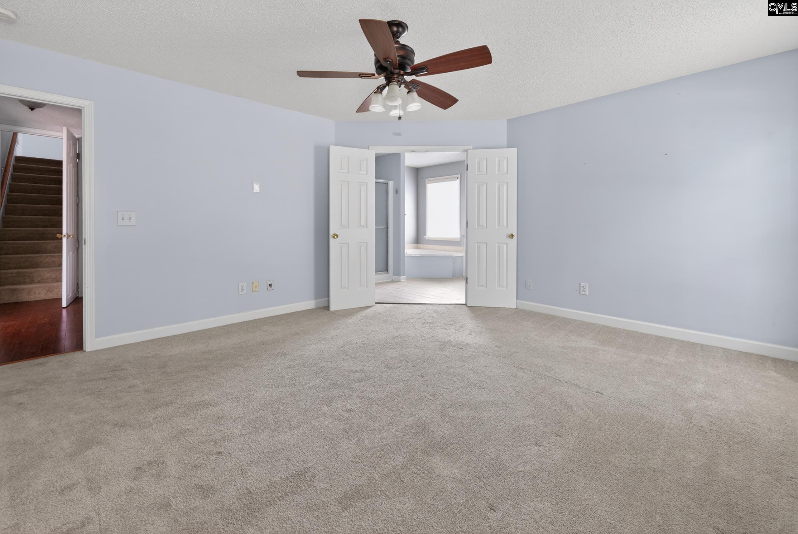 219 Plantation Pointe Drive Elgin, SC 29045 - Photo 24 of 56 a view of a livingroom with a ceiling fan