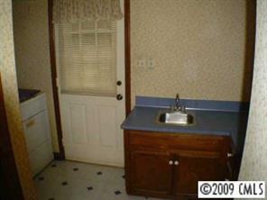 1417 Blacksnake Road Stanley, NC 28164 - Photo 5 of 8 a bathroom with a sink and a mirror