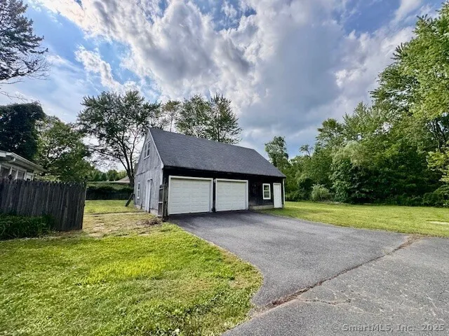 a house view with a garden space