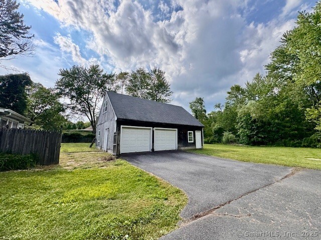 73 South Road Farmington, CT 06032 - Photo 3 of 8 a house view with a garden space