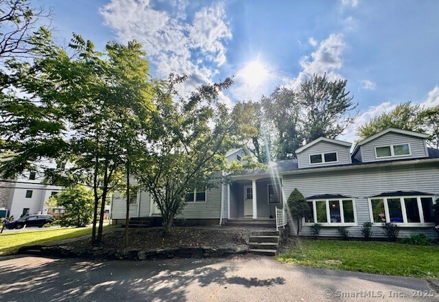 73 South Road Farmington, CT 06032 - Photo 7 of 8 a front view of a house with a yard