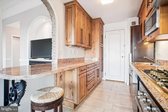 a bathroom with a glass shower door and a toilet