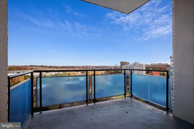 an aerial view of a house with a garden and lake view