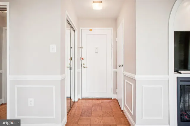 a view of a kitchen with a sink and cabinets