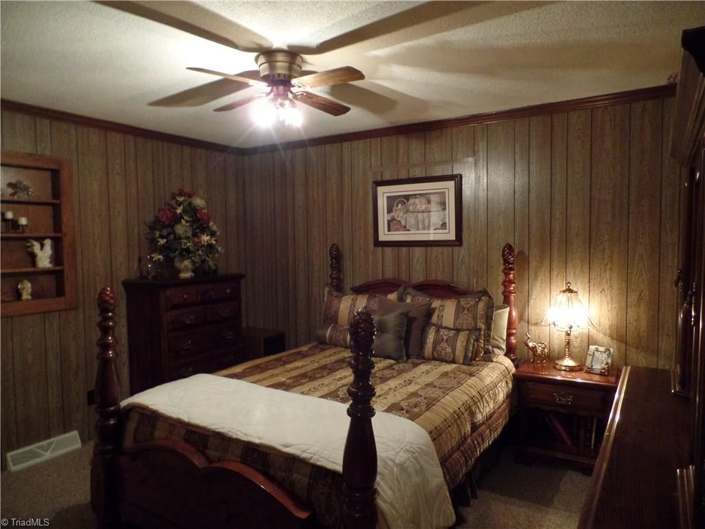 1022 Dulin Road Mocksville, NC 27028 - Photo 15 of 16 One of the original bedrooms, it features it's own bathroom with stand up shower.