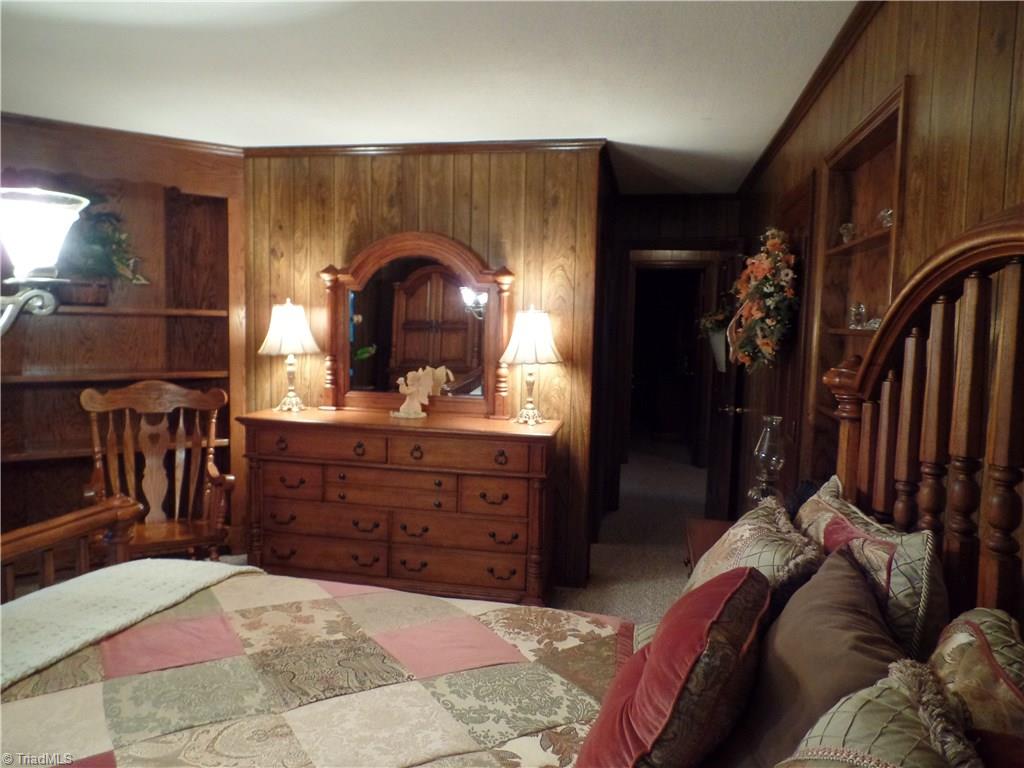 1022 Dulin Road Mocksville, NC 27028 - Photo 16 of 16 The third bedroom features built in shelves, along with it's own full bath.