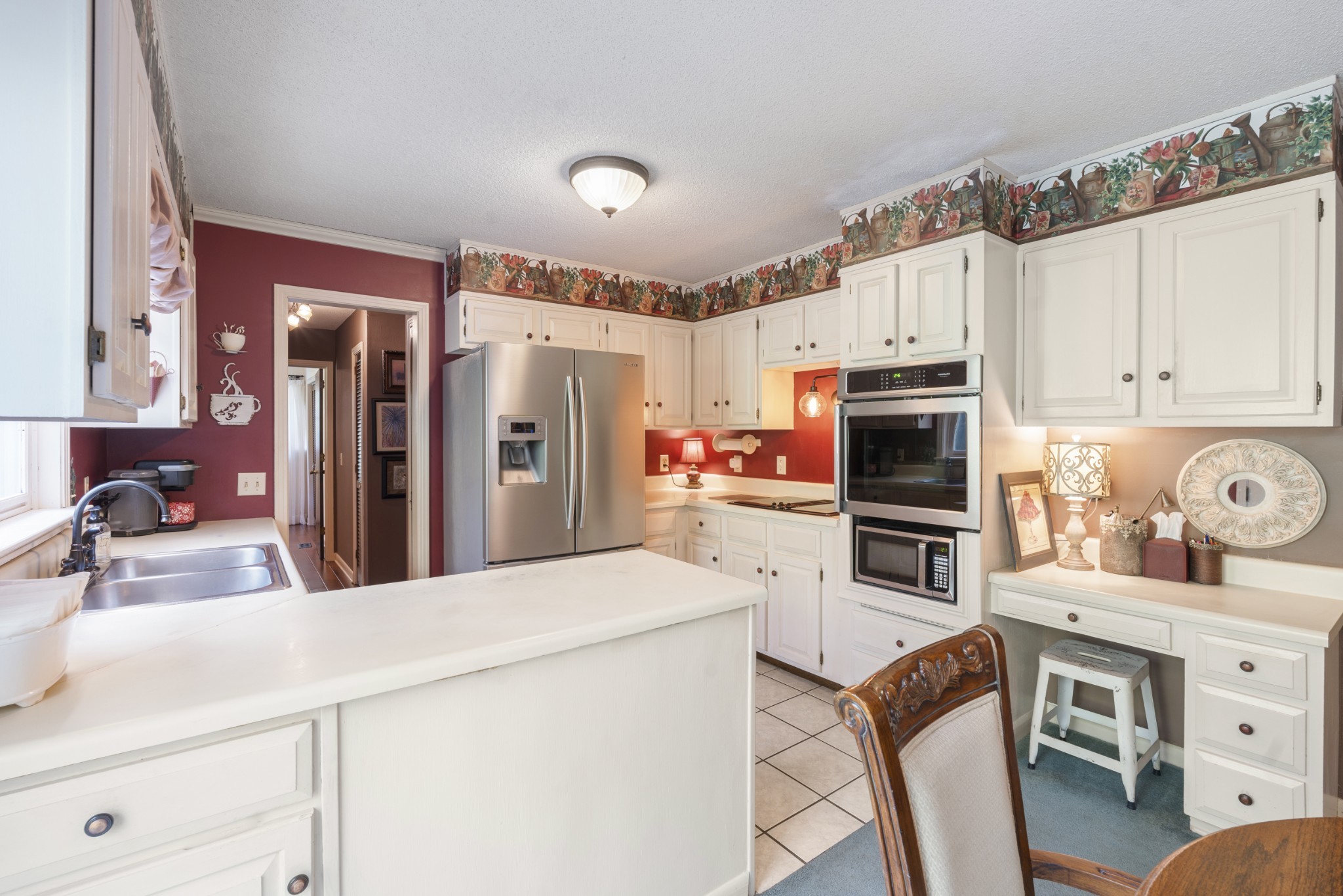 954 Belmont Road Manchester, TN 37355 - Photo 13 of 42 a kitchen with stainless steel appliances a stove refrigerator sink and cabinets