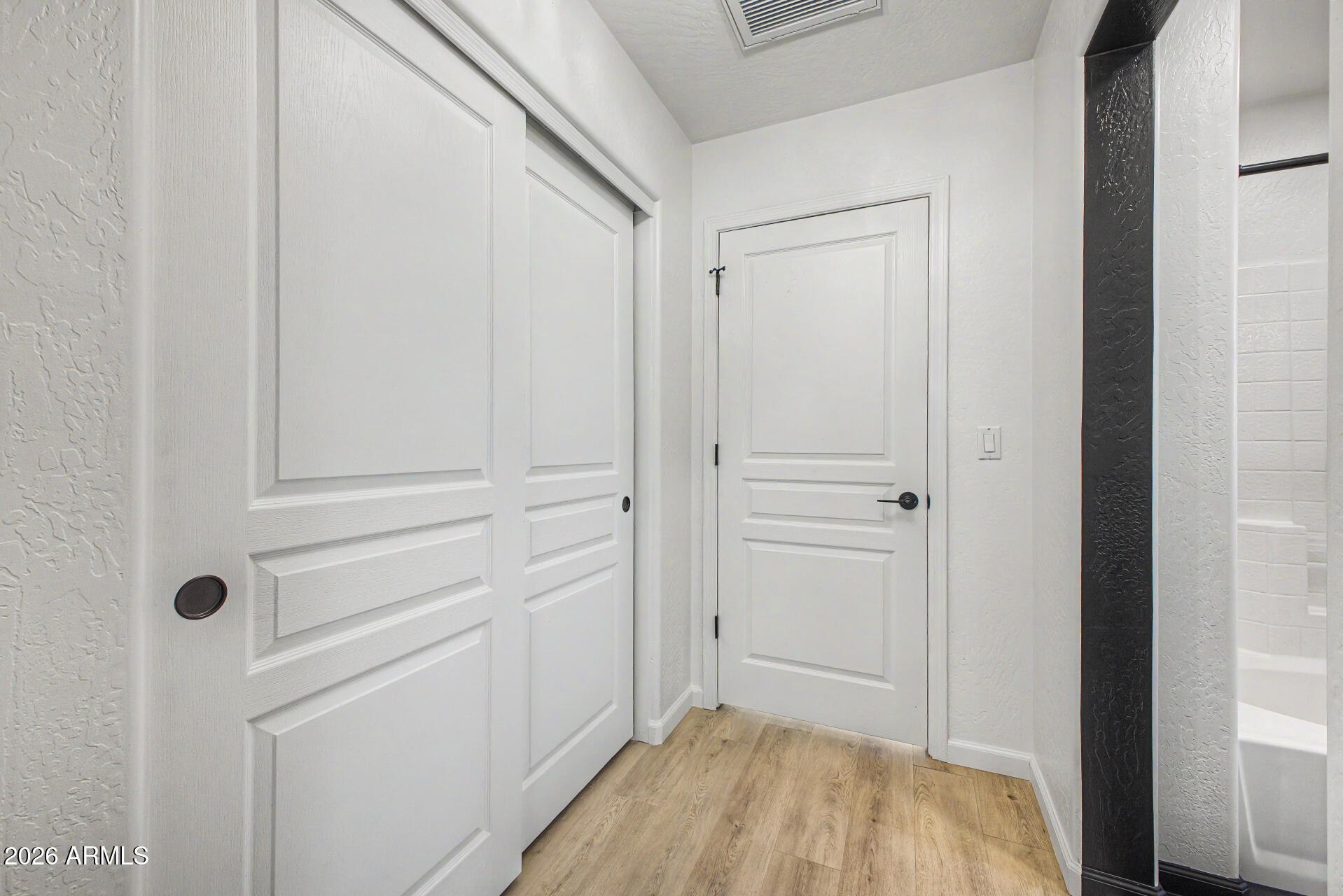 451 South Hawes Road, Unit 27 Mesa, AZ 85208 - Photo 14 of 27 a view of a closet area with bedroom