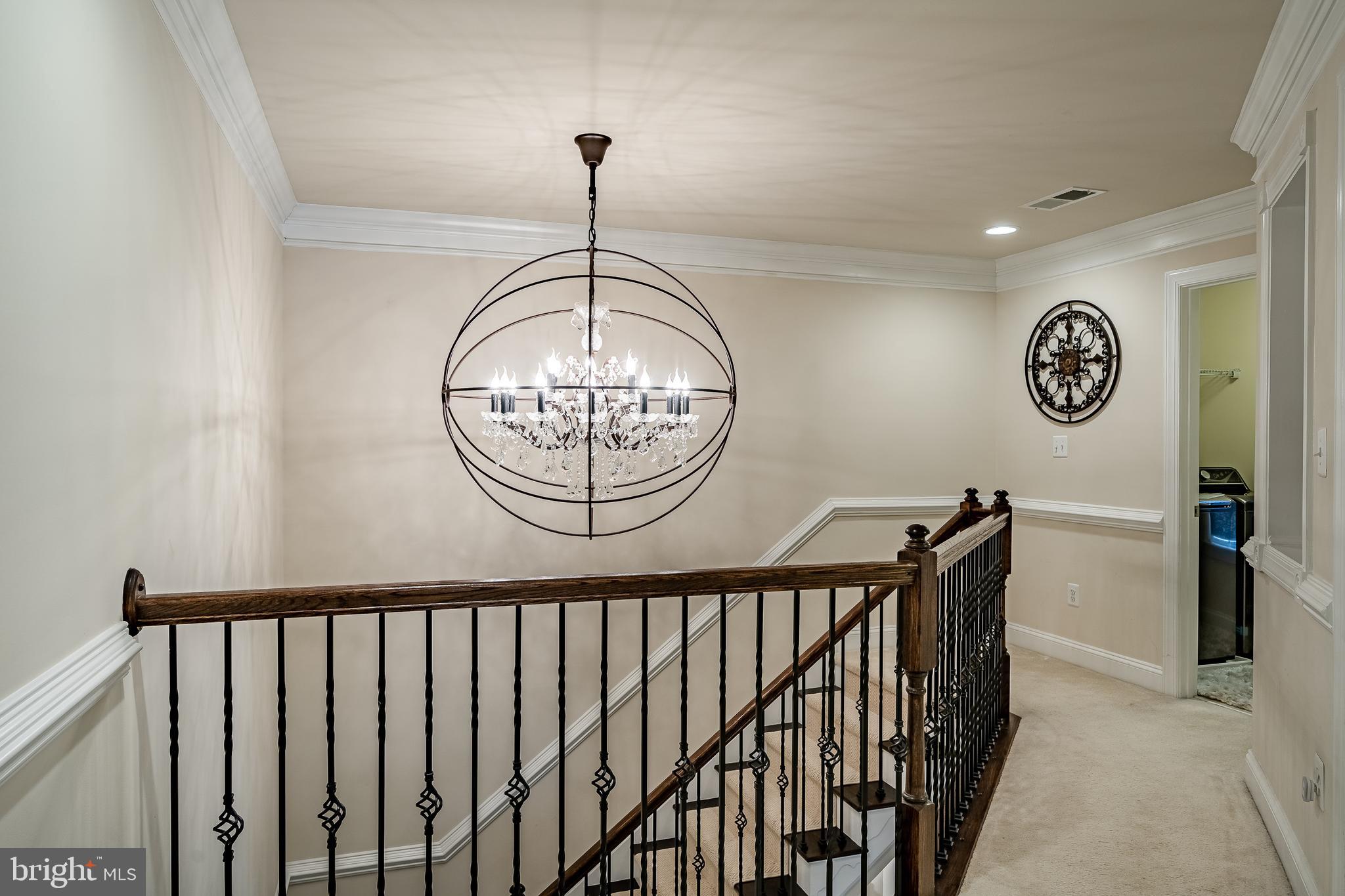 422 Quarry Point Road Malvern, PA 19355 - Photo 22 of 46 a view of a hallway of a hallway with a chandelier