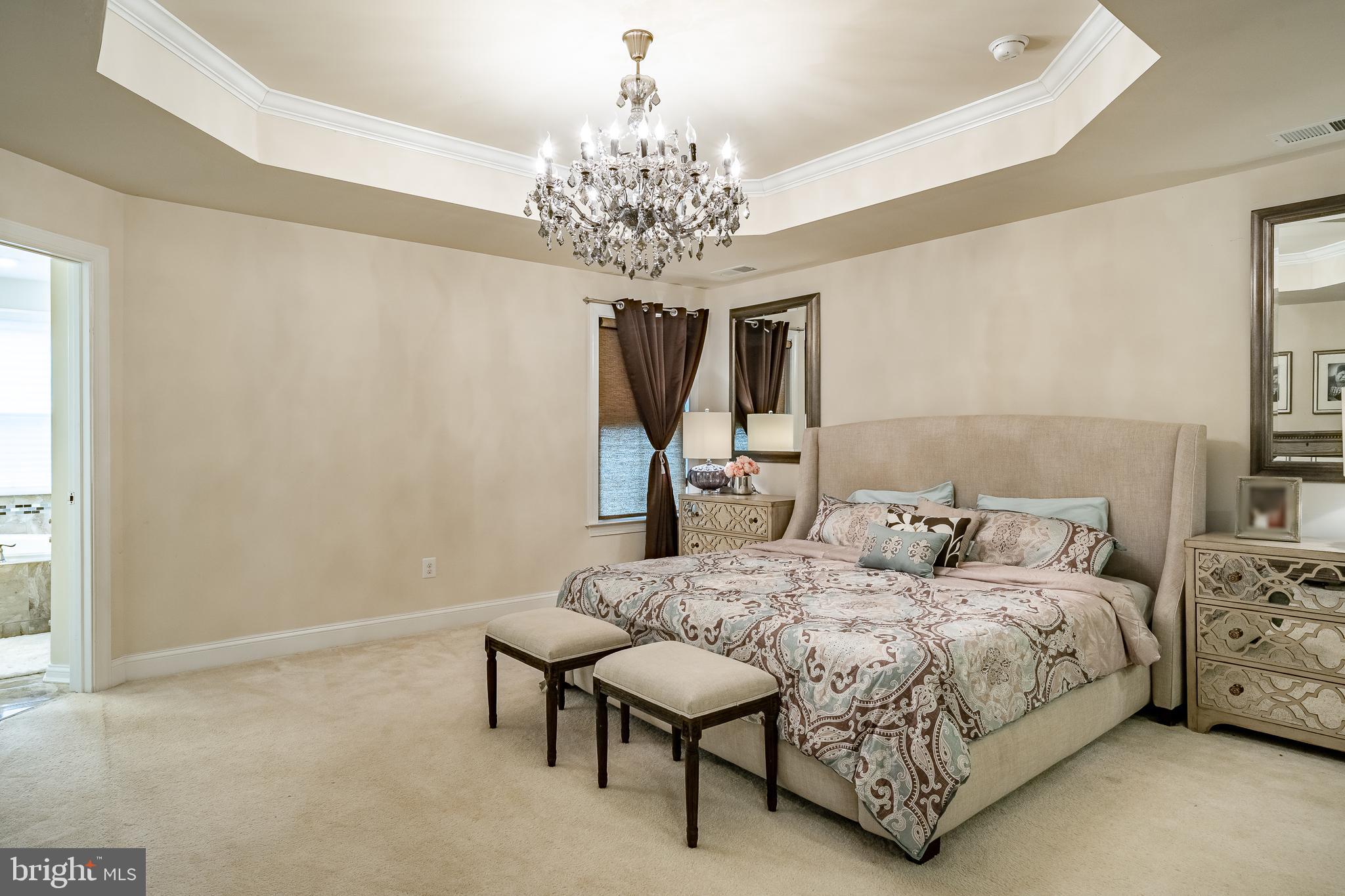 422 Quarry Point Road Malvern, PA 19355 - Photo 28 of 46 a bedroom with a bed and a chandelier