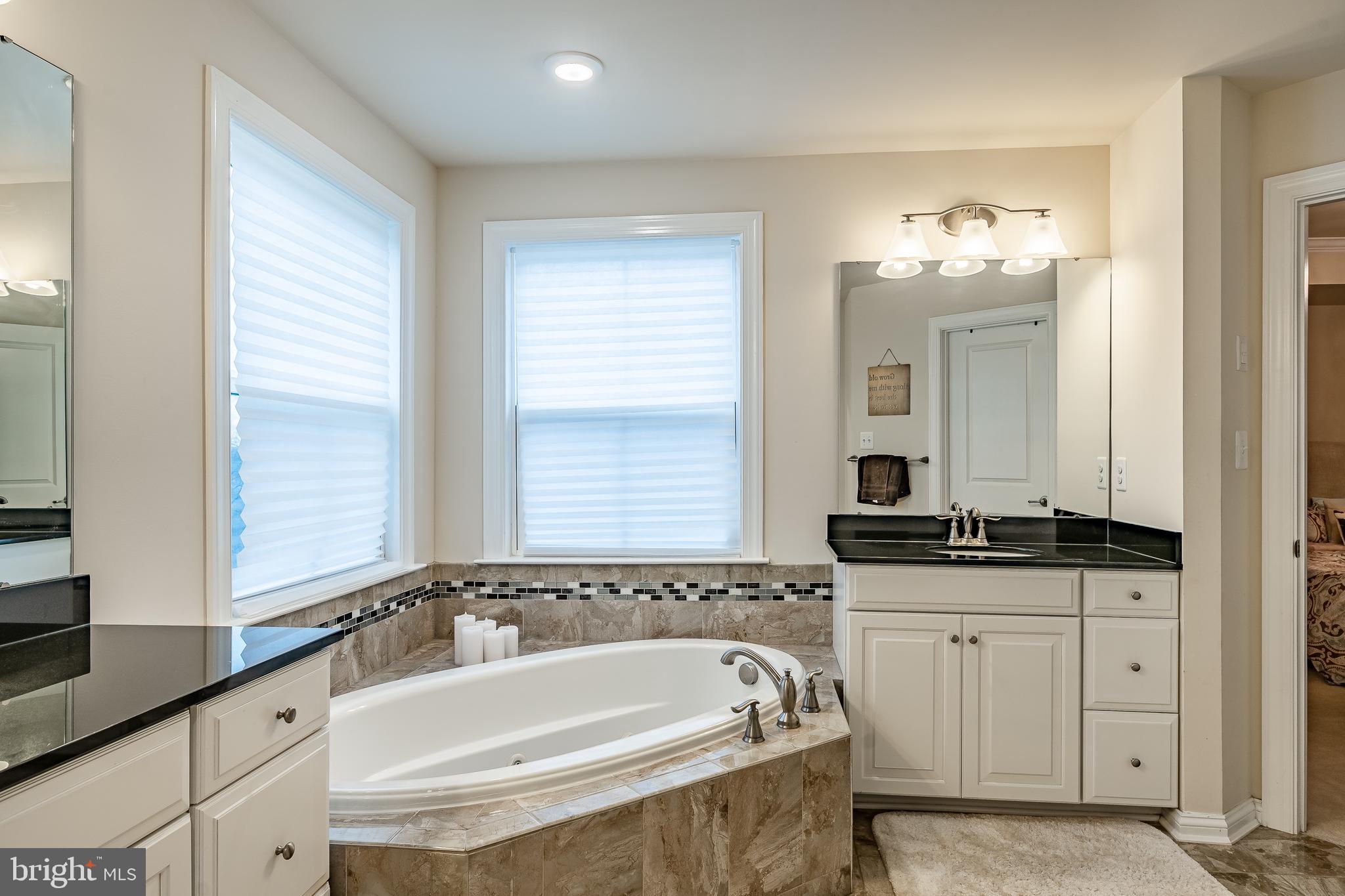 422 Quarry Point Road Malvern, PA 19355 - Photo 32 of 46 a bath room with a sink and a mirror