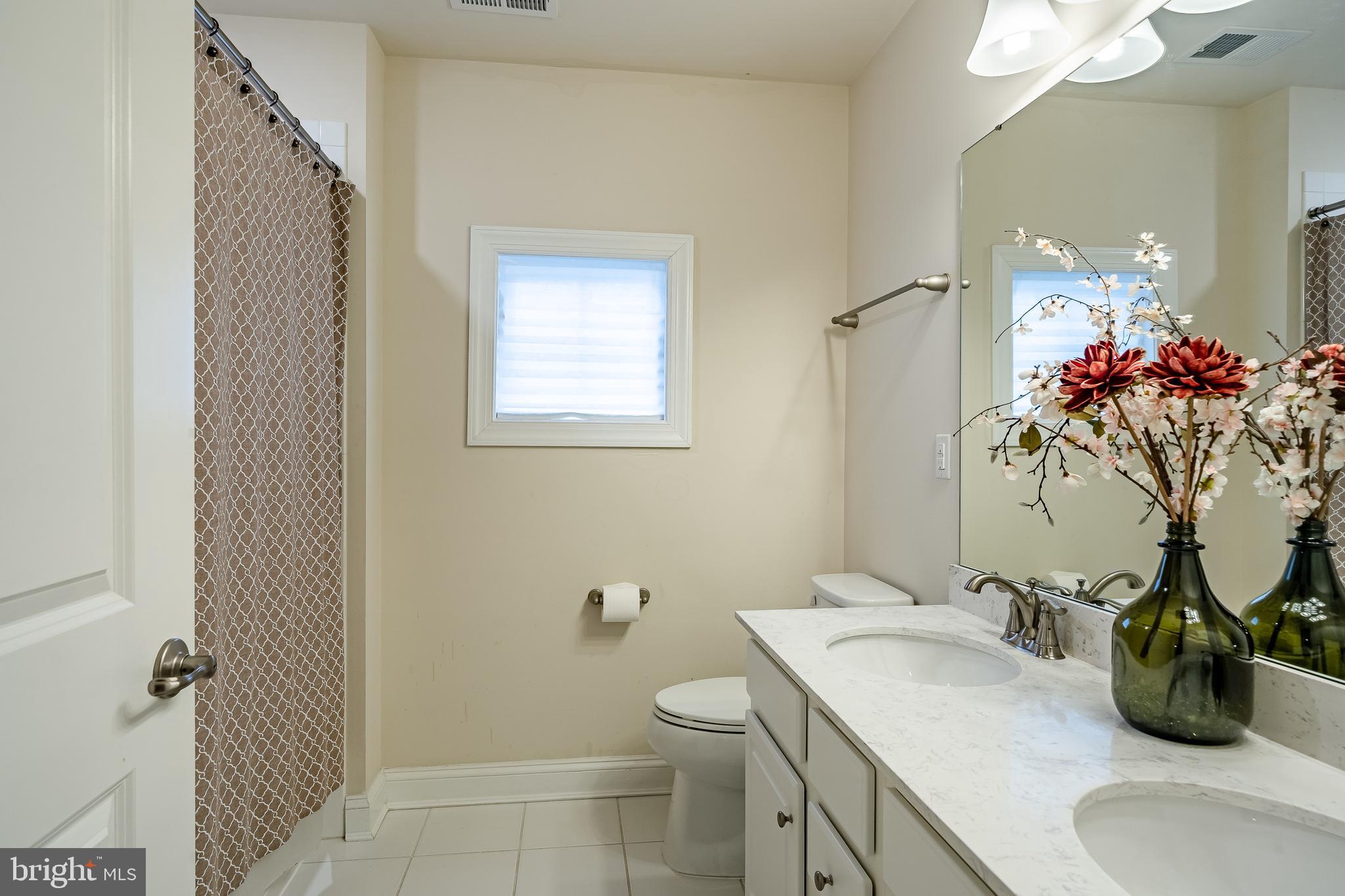 422 Quarry Point Road Malvern, PA 19355 - Photo 34 of 46 a bathroom with a sink a toilet and shower