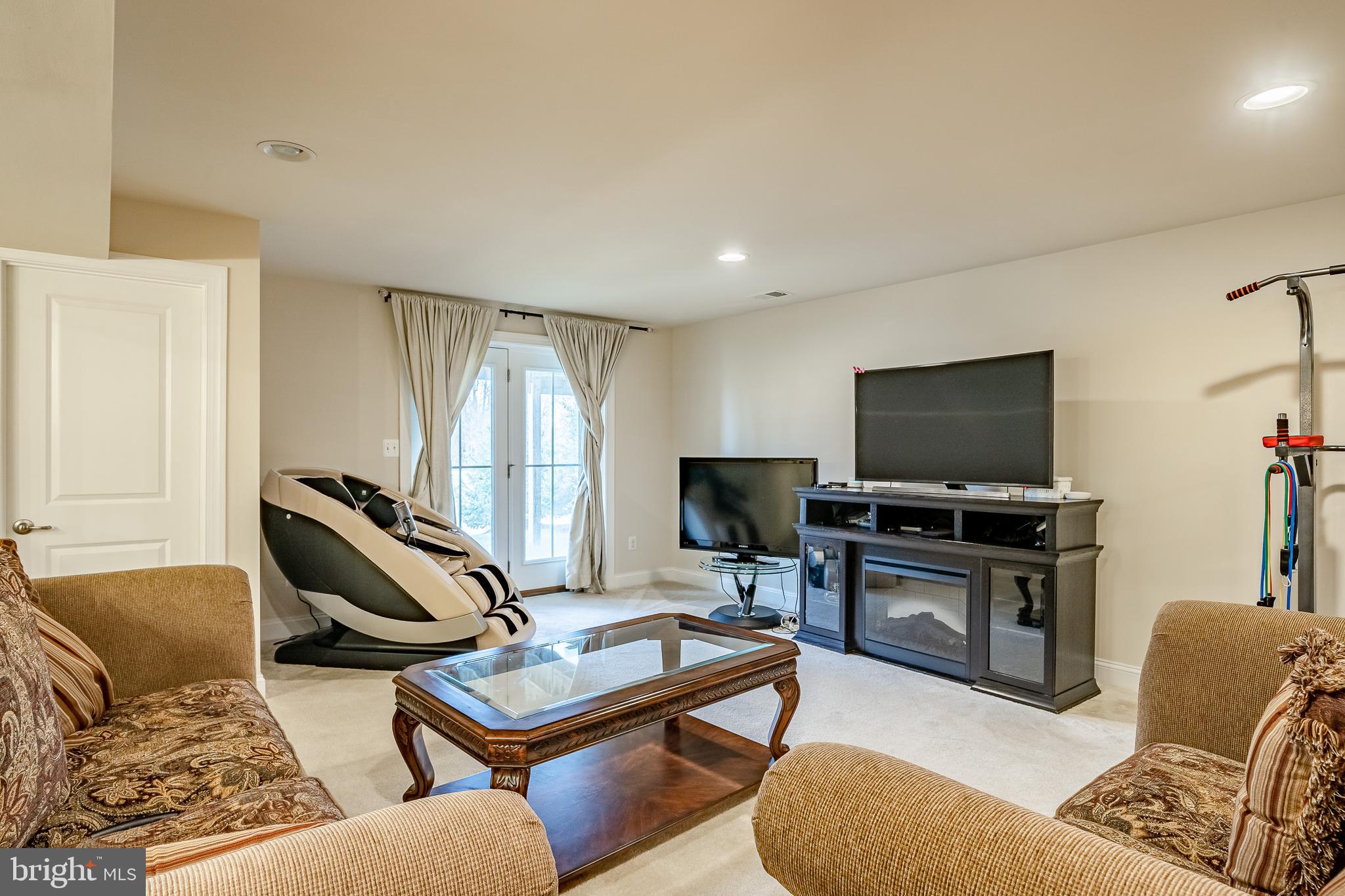 422 Quarry Point Road Malvern, PA 19355 - Photo 39 of 46 a living room with furniture and a flat screen tv