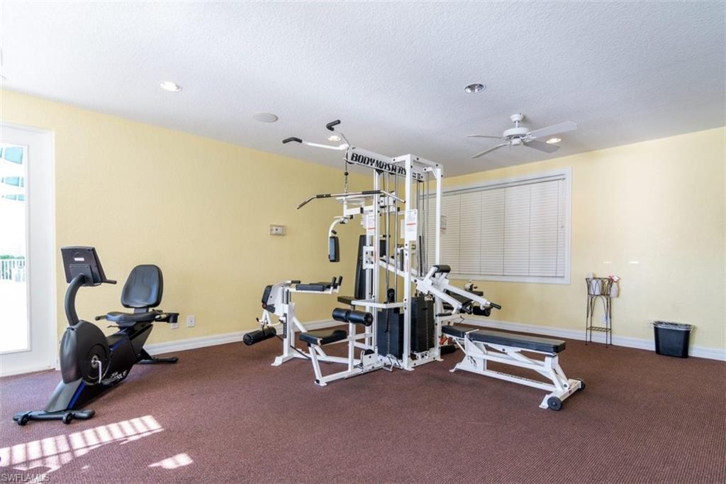 4635 St Croix Lane, Unit 1218 Naples, FL 34109 - Photo 33 of 40 Workout area featuring a textured ceiling, a ceiling fan, plenty of natural light, and recessed lighting