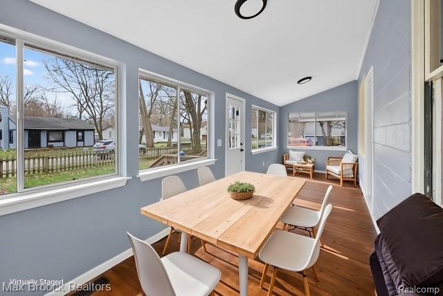 9024 Mandon Road White Lake, MI 48386 - Photo 6 of 39 Dining area with lofted ceiling and wood finished floors