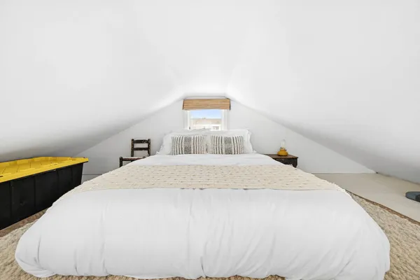 a bedroom with a bed and blue walls