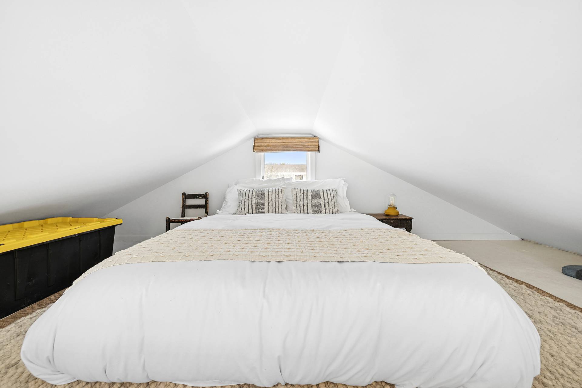 12 Jackson Road Montauk, NY 11954 - Photo 18 of 38 a bedroom with a bed and blue walls