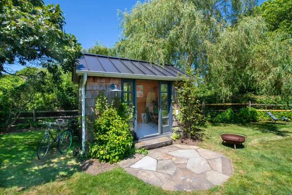 a front view of a house with garden