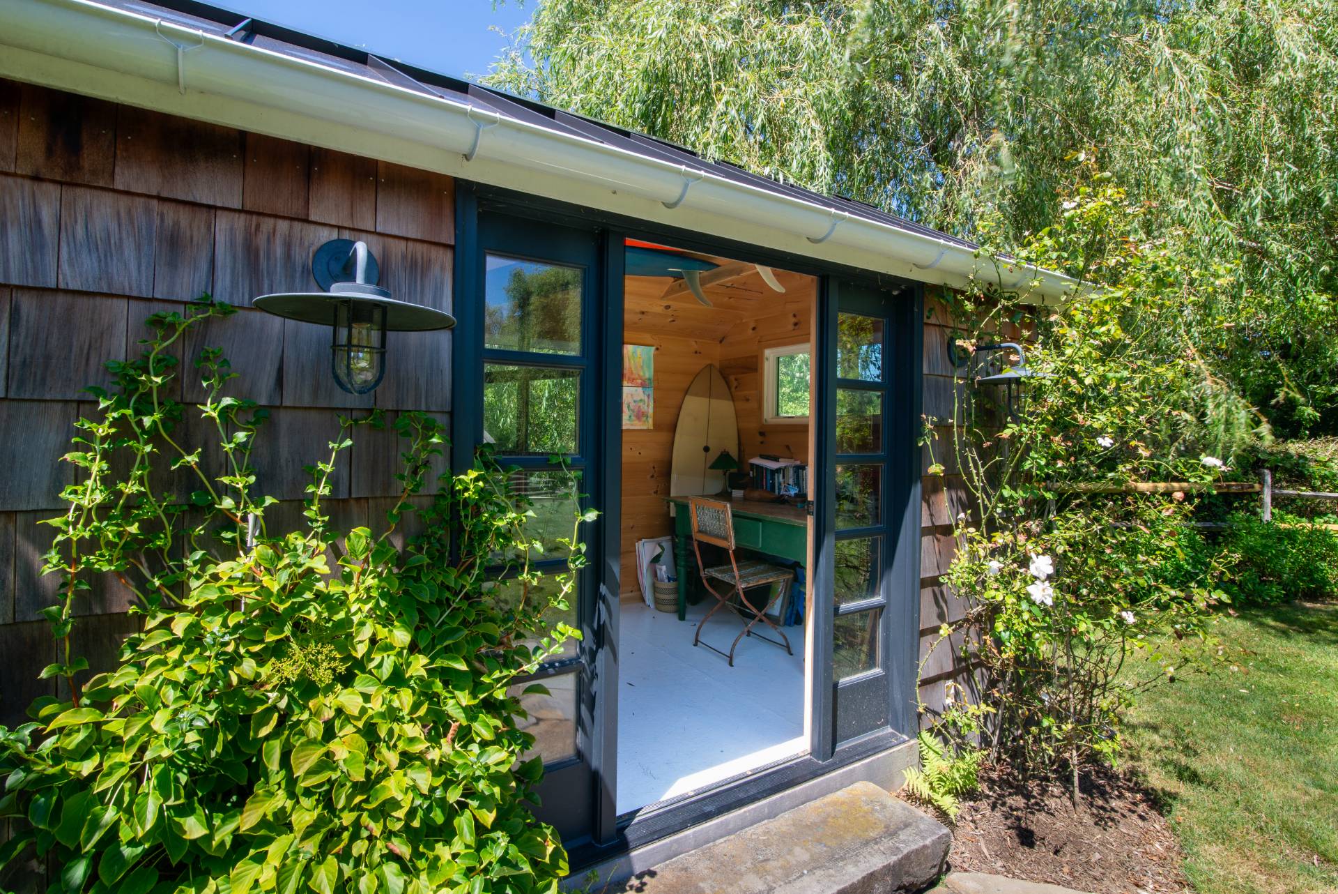 12 Jackson Road Montauk, NY 11954 - Photo 28 of 38 a view of a porch with chairs and potted plants