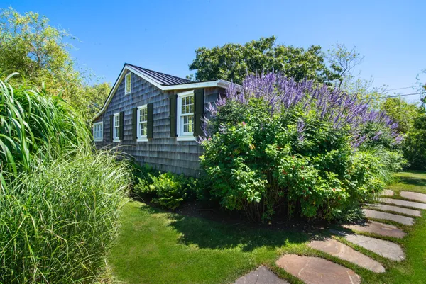 a backyard of a house with lots of green space