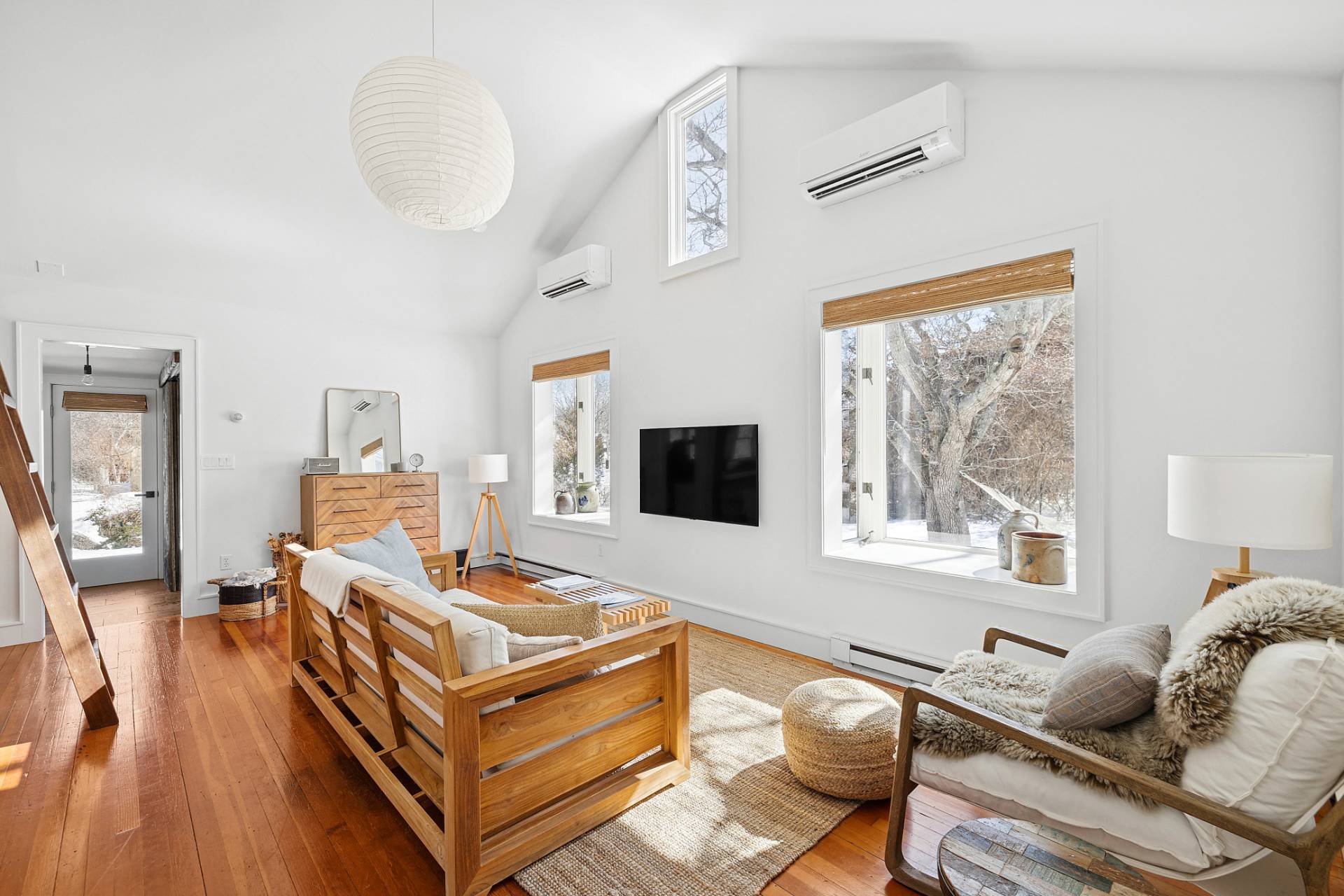 12 Jackson Road Montauk, NY 11954 - Photo 6 of 38 a living room with furniture and a flat screen tv