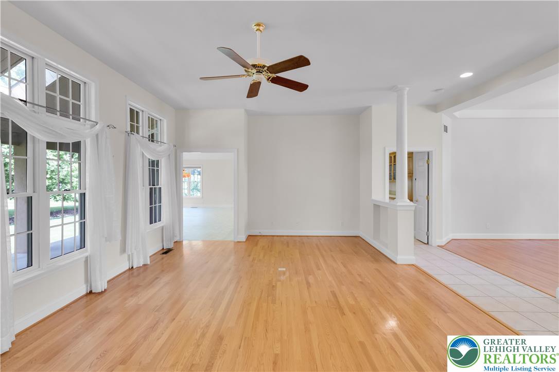 268 Jefferson Place Bethlehem, PA 18020 - Photo 13 of 49 a view of empty room with wooden floor and windows