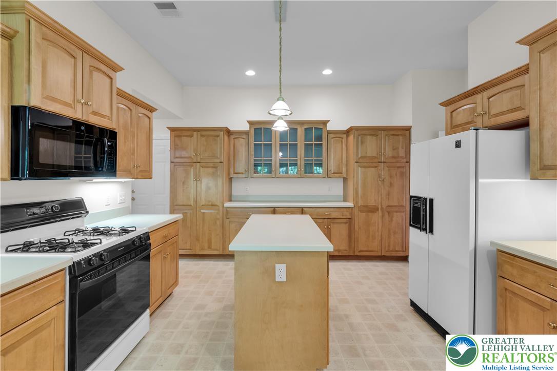 268 Jefferson Place Bethlehem, PA 18020 - Photo 16 of 49 a kitchen with stainless steel appliances granite countertop a stove refrigerator sink and microwave