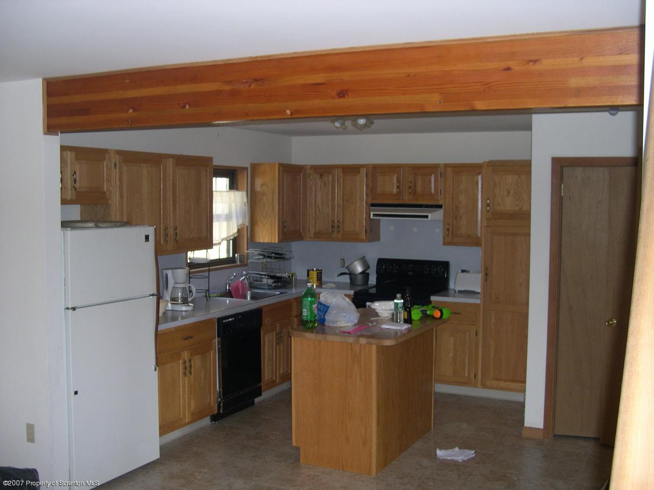 2400 Crest View Road Lake Ariel, PA 18436 - Photo 3 of 9 a kitchen view with cabinets a sink and a refrigerator