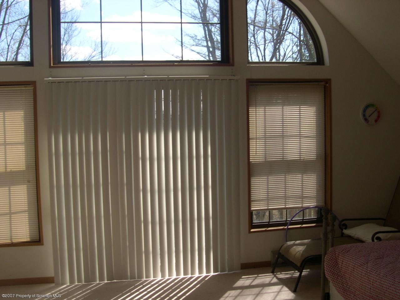 2400 Crest View Road Lake Ariel, PA 18436 - Photo 4 of 9 a view of a window and chair in the balcony