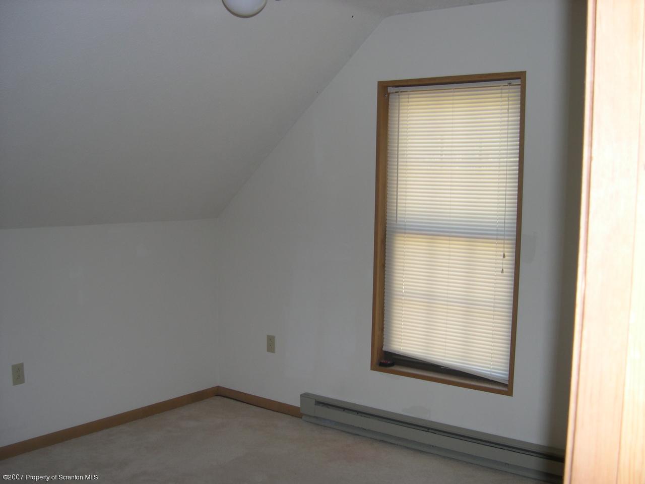 2400 Crest View Road Lake Ariel, PA 18436 - Photo 6 of 9 an empty room with a window