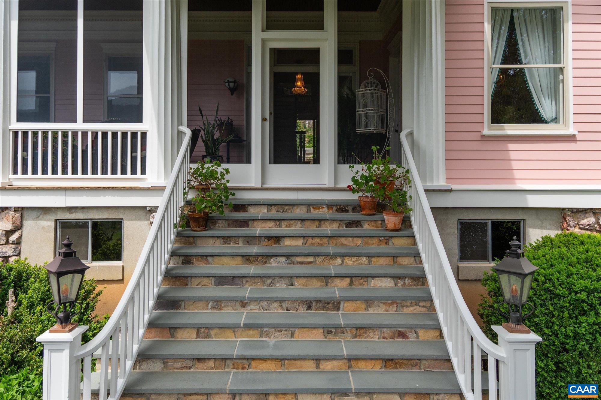 356 Routier Hill Road Hot Springs, VA 24445 - Photo 13 of 75 a front view of a house with potted plants