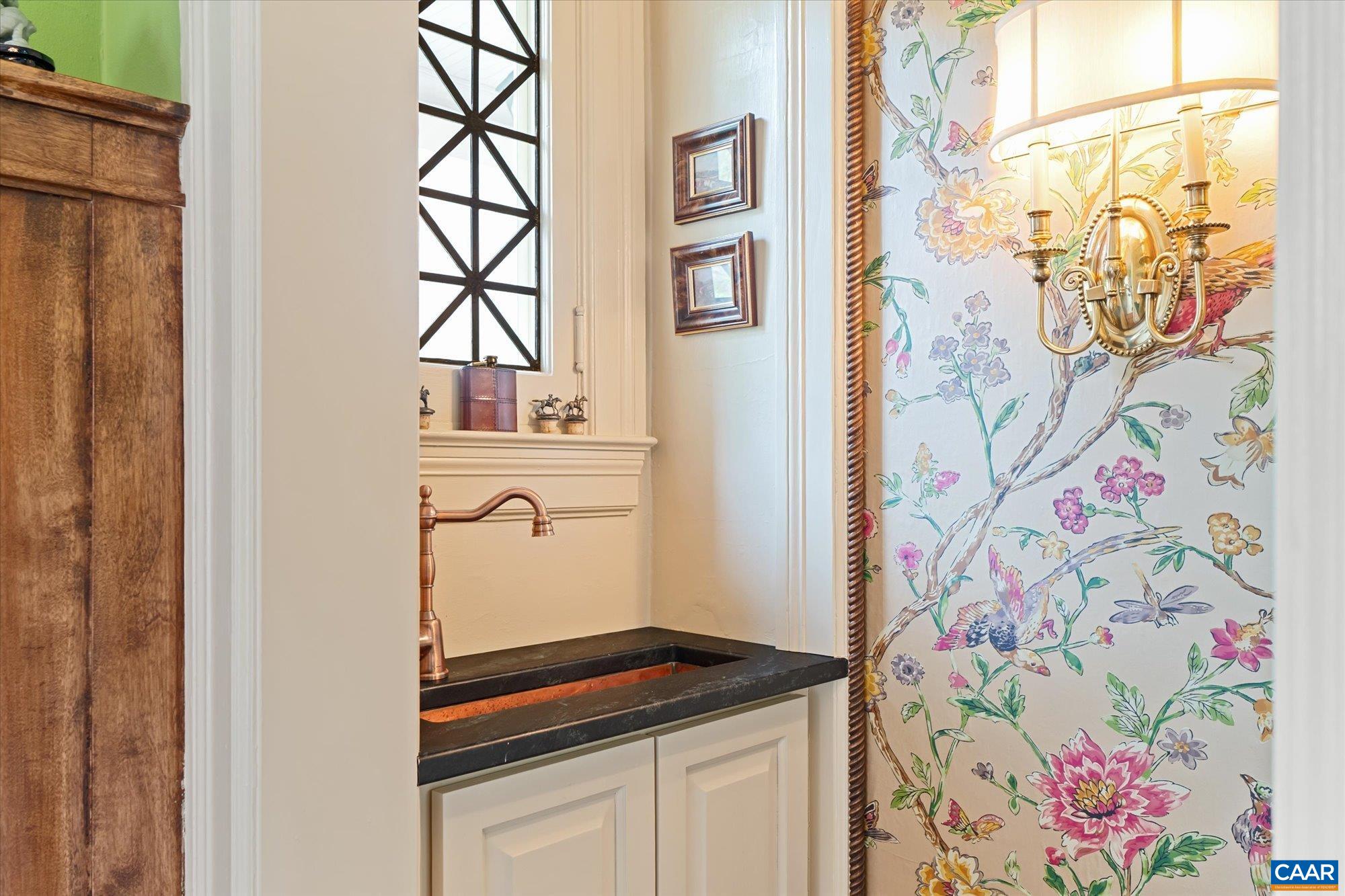 356 Routier Hill Road Hot Springs, VA 24445 - Photo 18 of 75 a bathroom with a granite countertop sink and a window