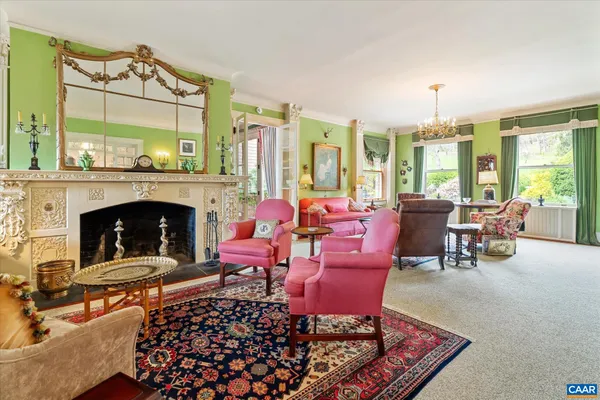a living room with furniture and a rug