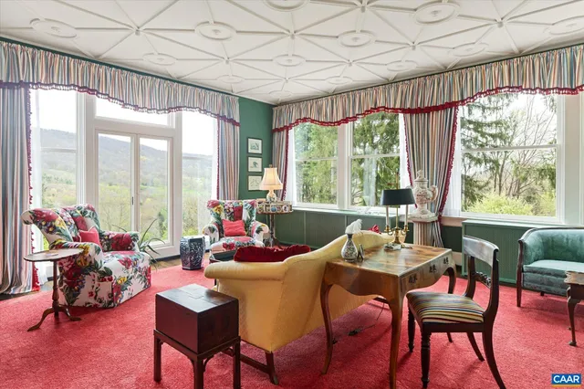 a kitchen with stainless steel appliances granite countertop wooden floor dining table and chairs