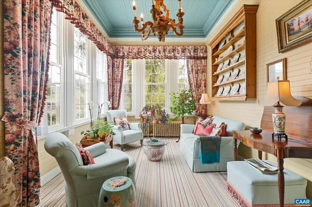 a bedroom with a bed dresser and a window