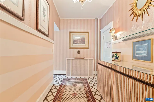 a living room with furniture a fireplace and a floor to ceiling window
