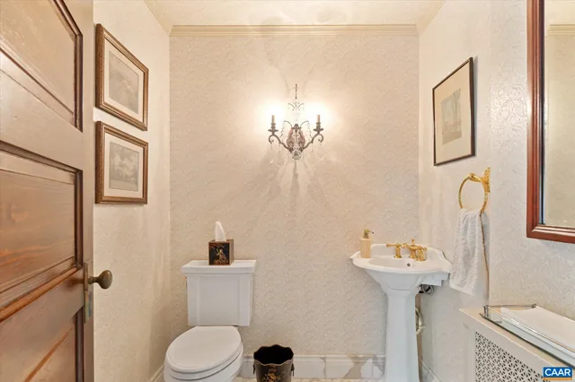 a bedroom with a bed a table and chair