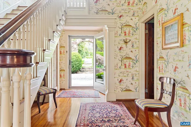 a view of a livingroom with furniture and a potted plant