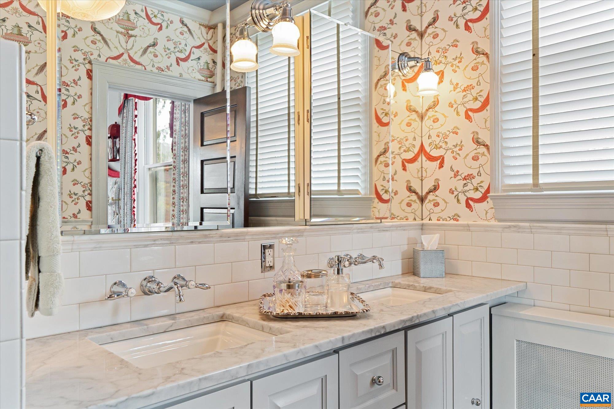 356 Routier Hill Road Hot Springs, VA 24445 - Photo 49 of 75 a bathroom with a granite countertop sink and a window