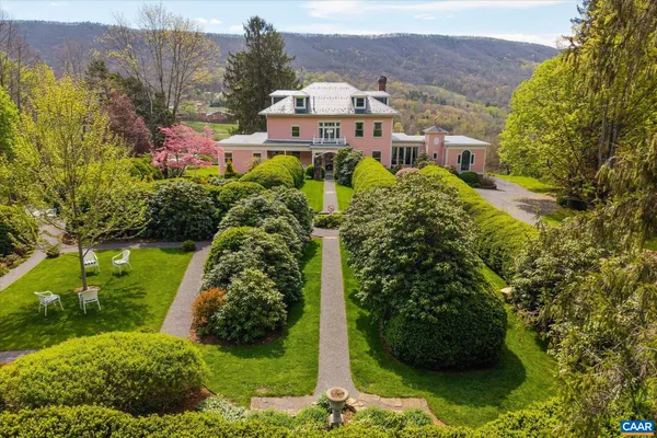 a view of a house with a garden