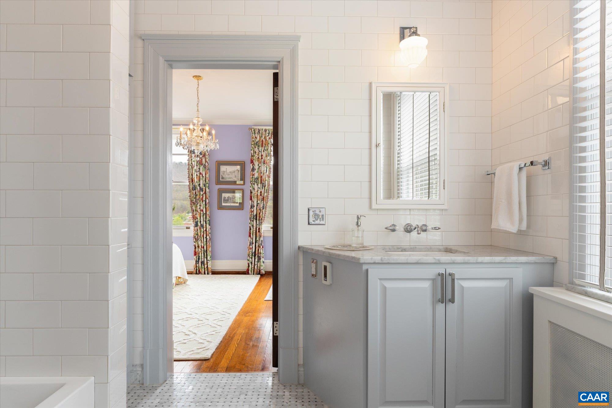 356 Routier Hill Road Hot Springs, VA 24445 - Photo 55 of 75 a bathroom with a granite countertop sink and a mirror