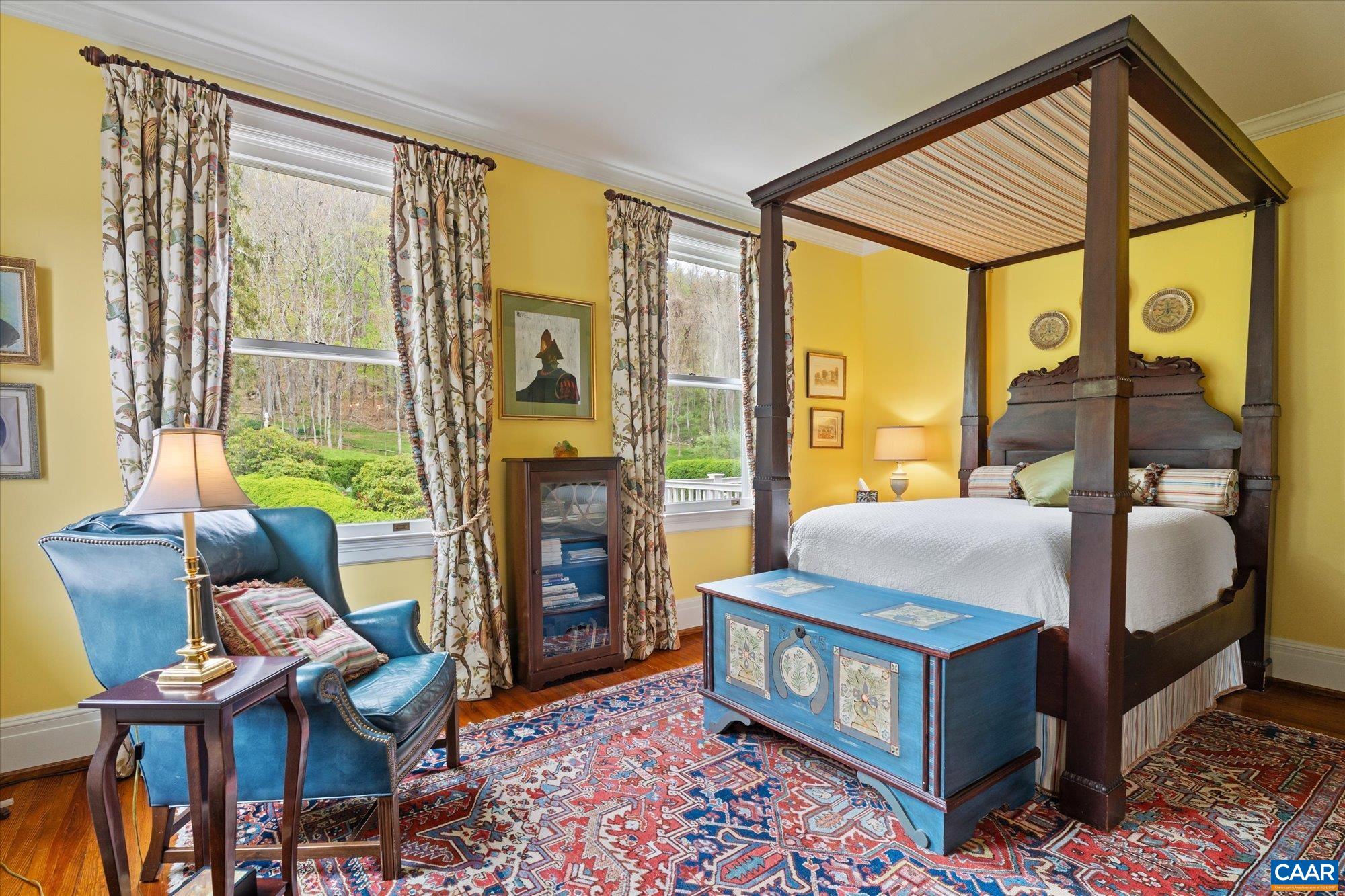 356 Routier Hill Road Hot Springs, VA 24445 - Photo 57 of 75 a living room with furniture a fireplace and a floor to ceiling window