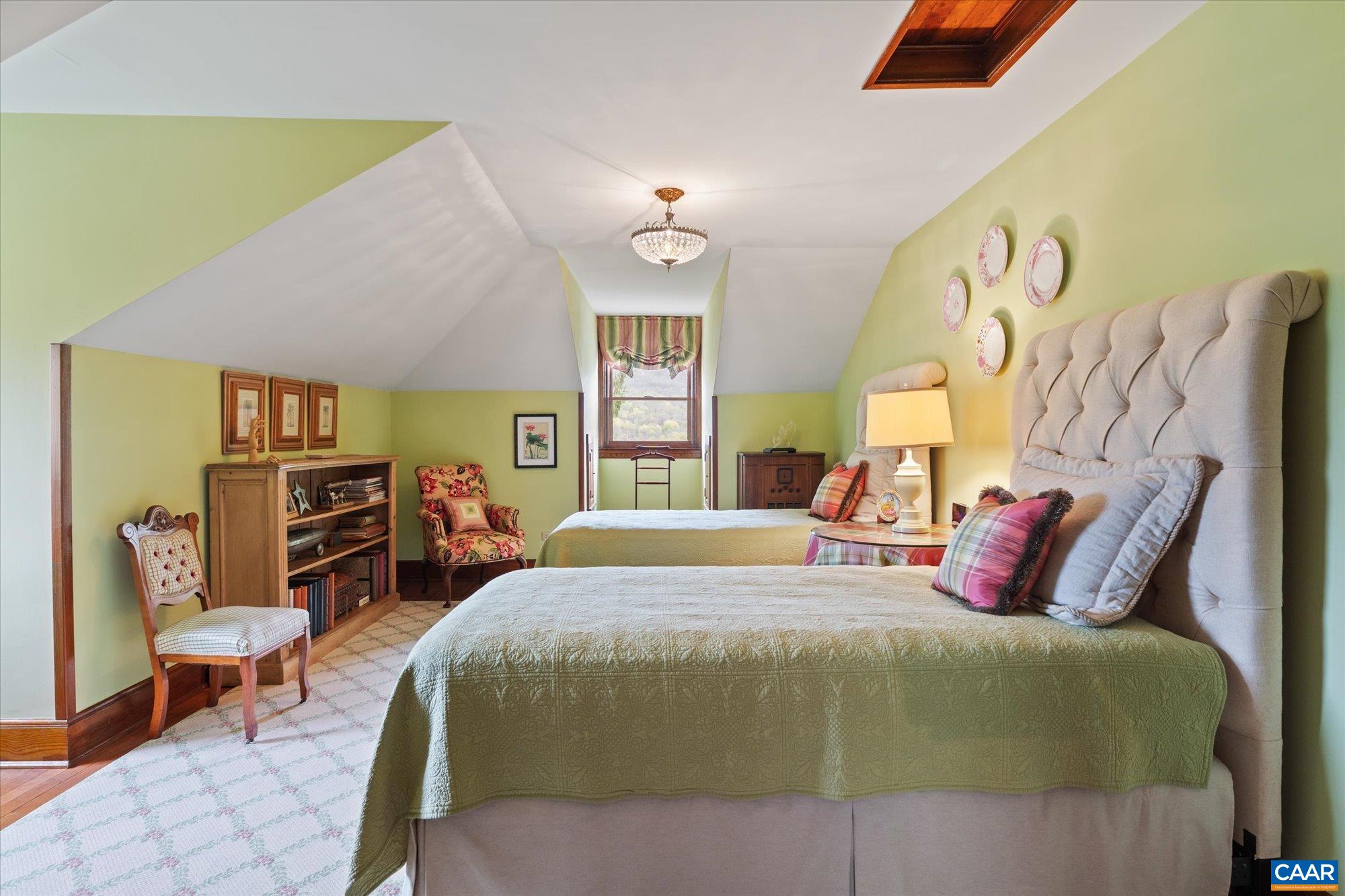356 Routier Hill Road Hot Springs, VA 24445 - Photo 57 of 75 a bedroom with a bed a table and chair