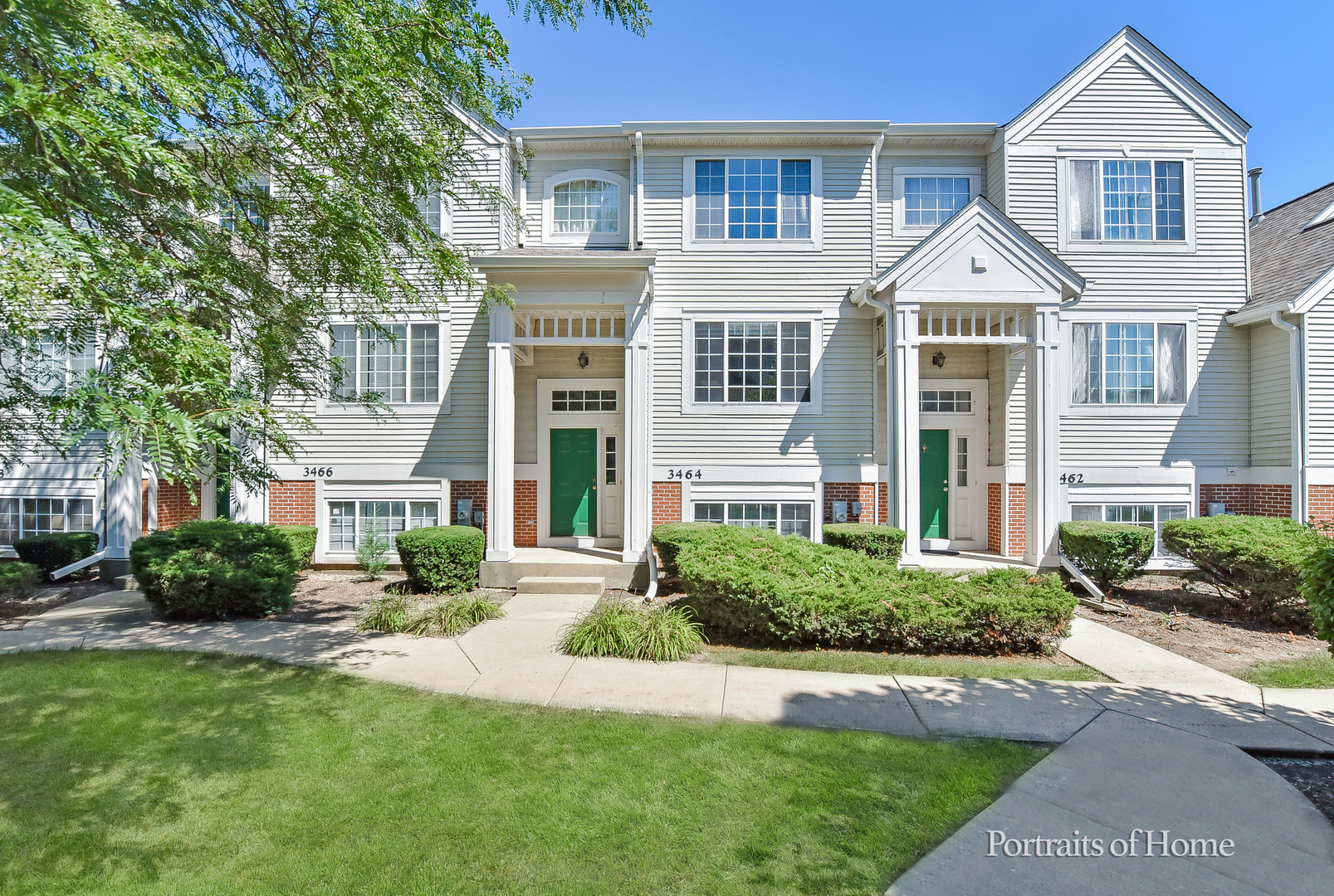 3464 Ravinia Circle Aurora, IL 60504 - Photo 1 of 22 a front view of a house with a yard and trees