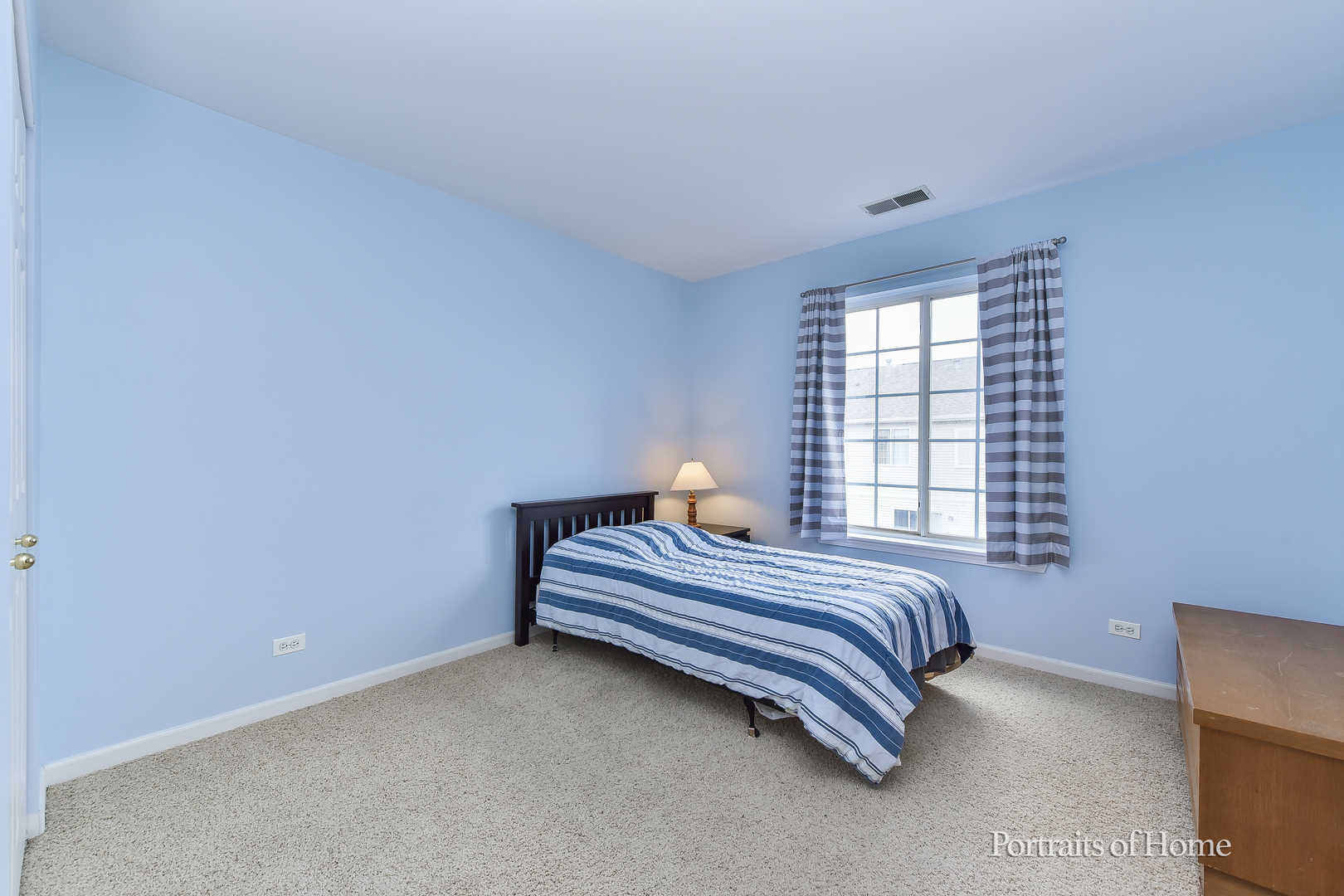 3464 Ravinia Circle Aurora, IL 60504 - Photo 16 of 22 a bedroom with a bed and a window