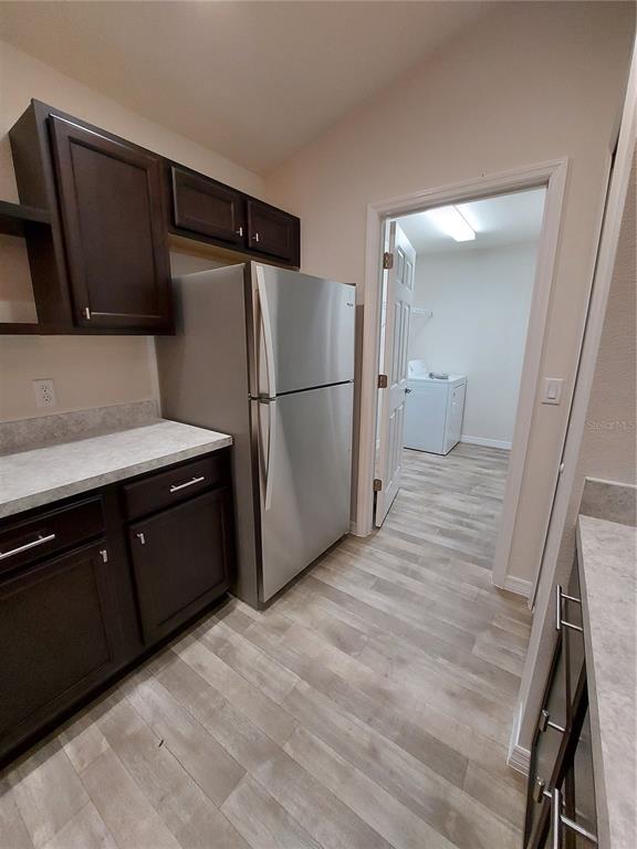 3331 Southwest 153rd Pl Road Ocala, FL 34473 - Photo 11 of 35 a kitchen with a refrigerator and a sink