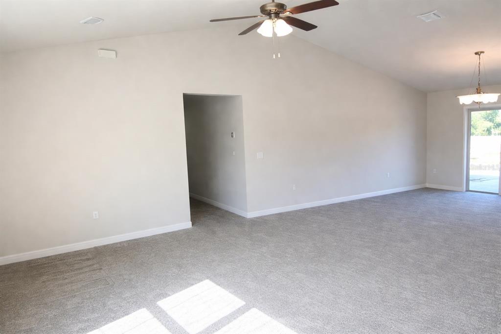 3331 Southwest 153rd Pl Road Ocala, FL 34473 - Photo 12 of 35 an empty room with a window and a fan