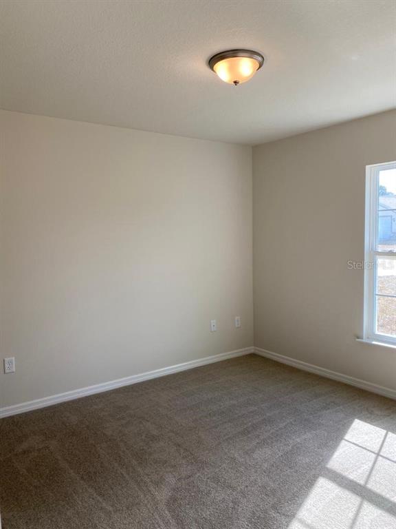 3331 Southwest 153rd Pl Road Ocala, FL 34473 - Photo 26 of 35 an empty room with a window